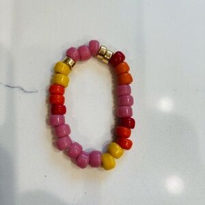 Plated 18 kt barrel and glass rainbow beads Elastic Bracelet